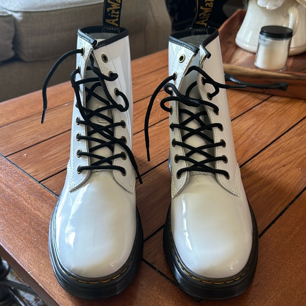 Brand new never worn Doc Martens. White patent with black laces.  Excellent